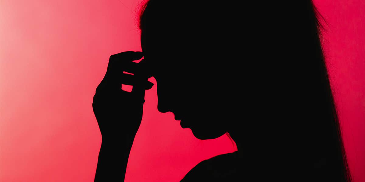 This Type Of Woman Is More Likely To Be Depressed Than Men stressed woman against red background