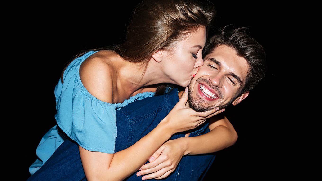 woman flirting with smiling man