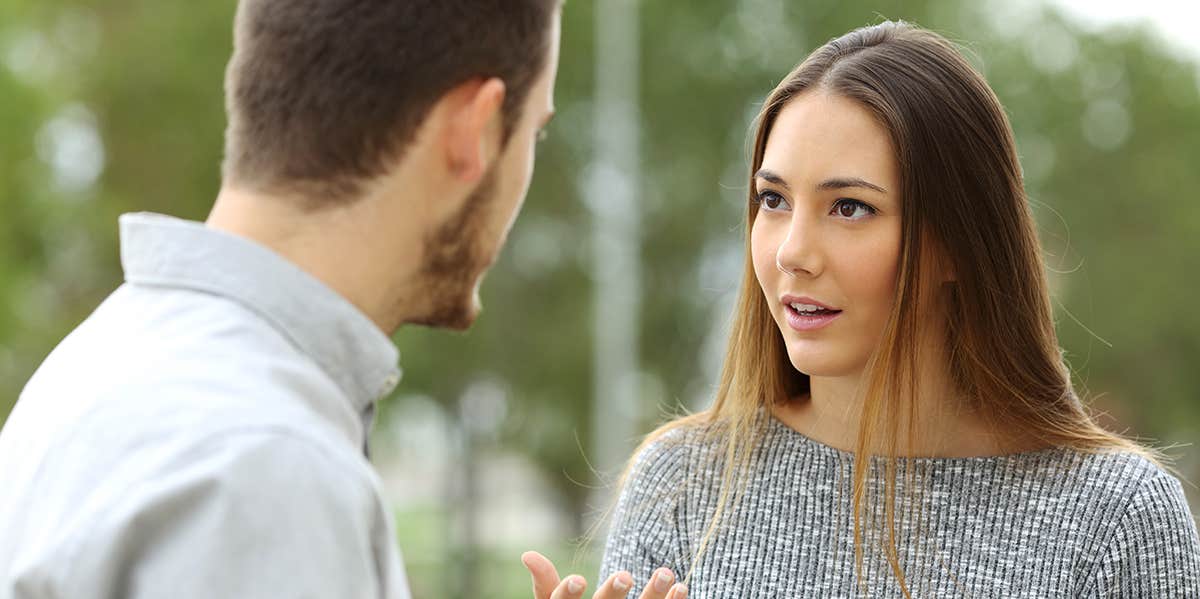 man and woman talking