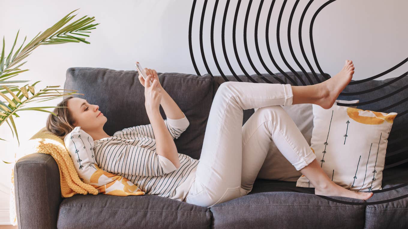 woman sitting on her couch exchanging flirty messages to her husband