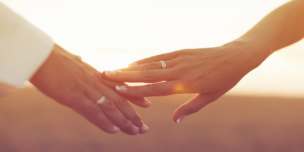 married hands touching 