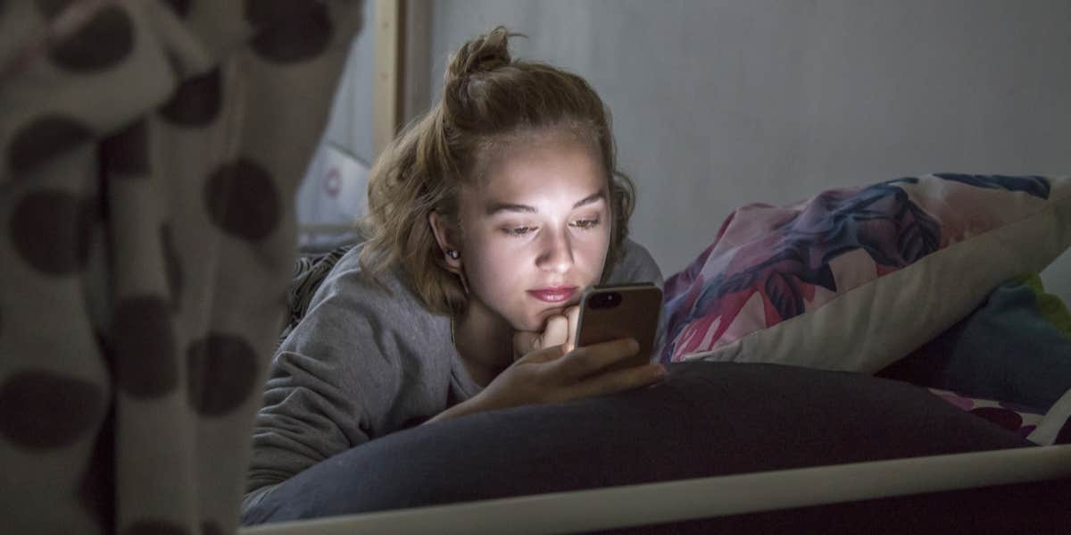 woman looking at phone