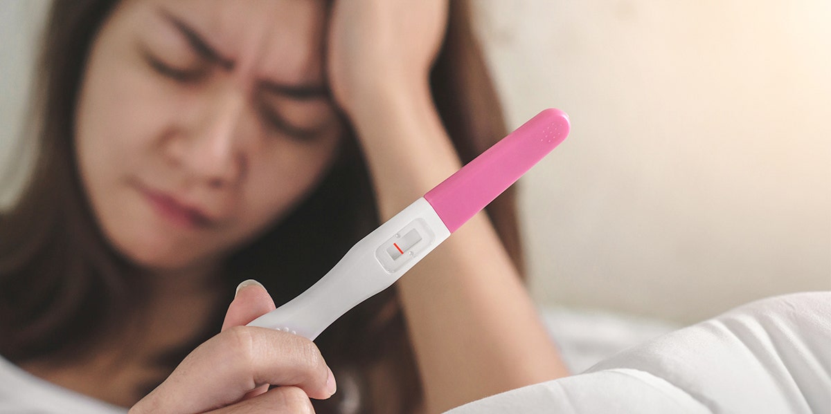 woman with a negative pregnancy test