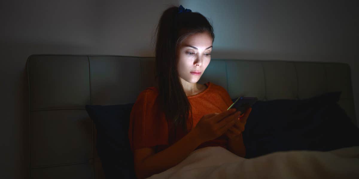 woman looking at phone