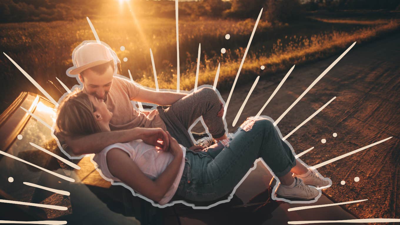 couple enjoying the summer sun on the hood of the car