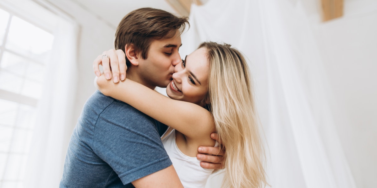 man and woman hugging