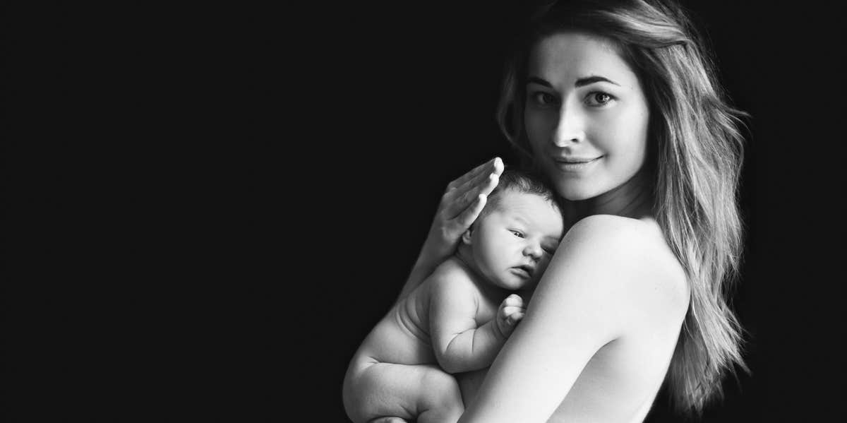 Why I Want My Daughter To See Me Naked mother holding baby