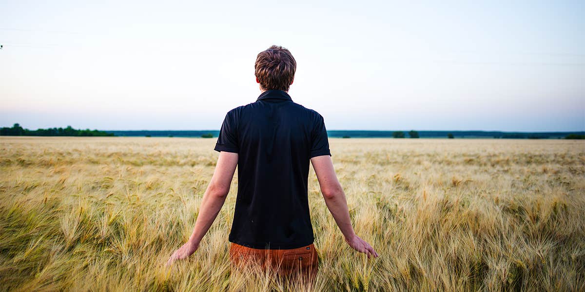 man standing in field