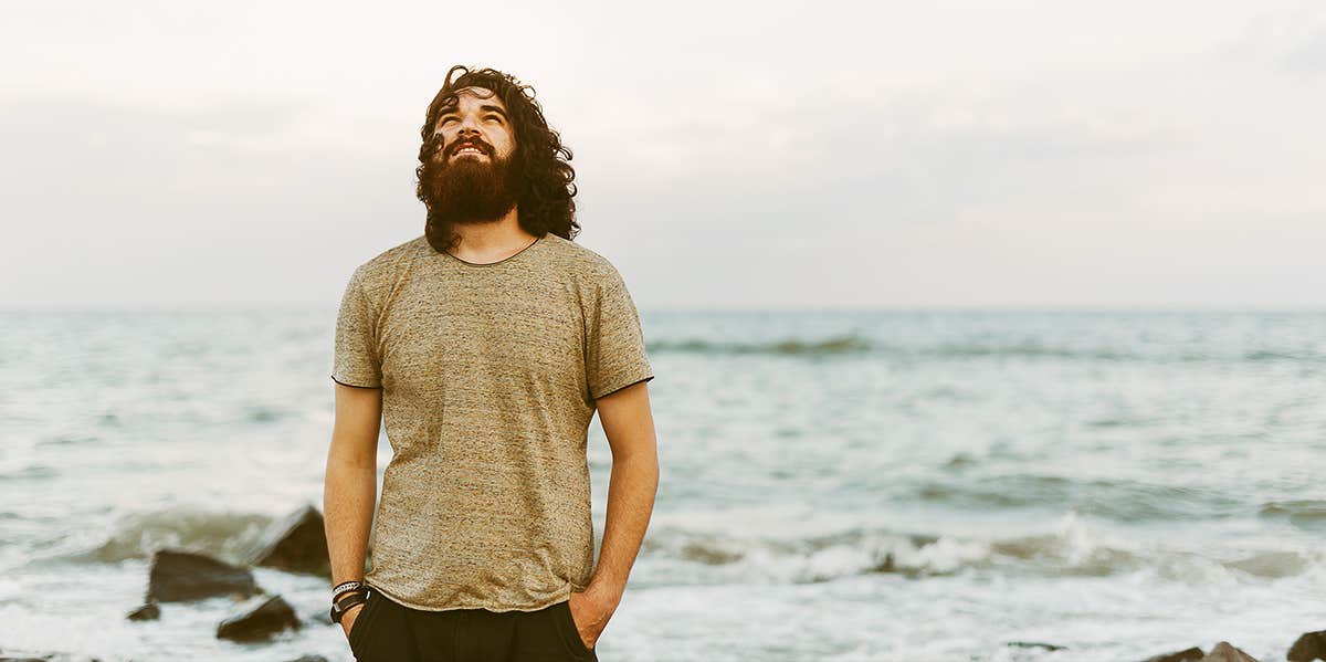 man standing on the beach