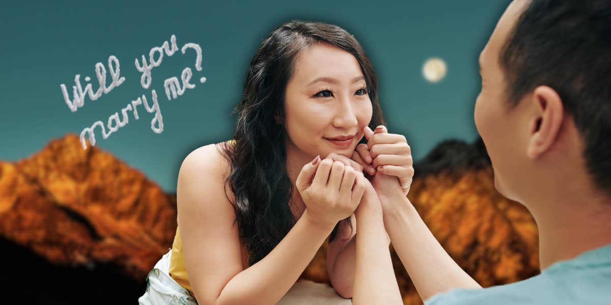 a woman holding a man's hands and lovingly gazing at him in front of mountains and clouds that say "will you marry me"
