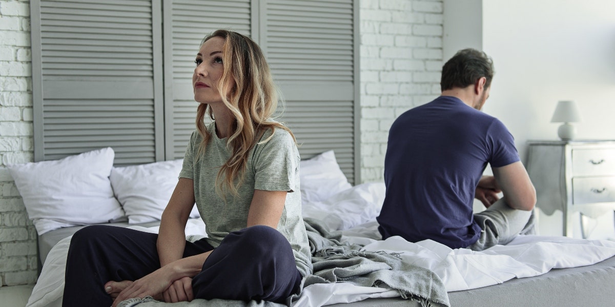 why won't he file for divorce couple sitting back to back in bed