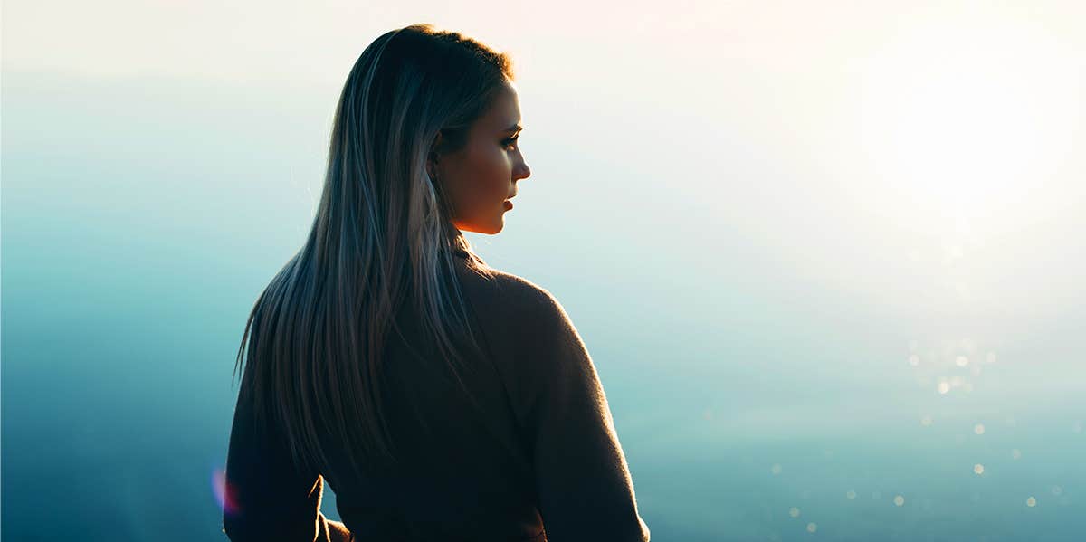 woman standing in sun