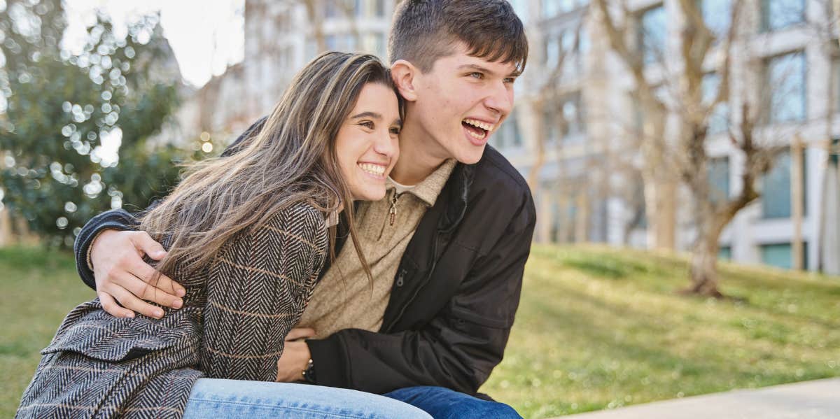 happy couple on park bench