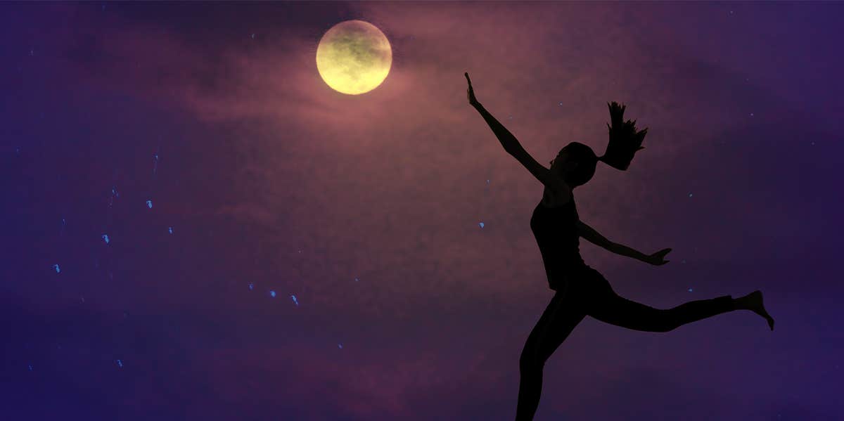 woman's silhouette at night with moon