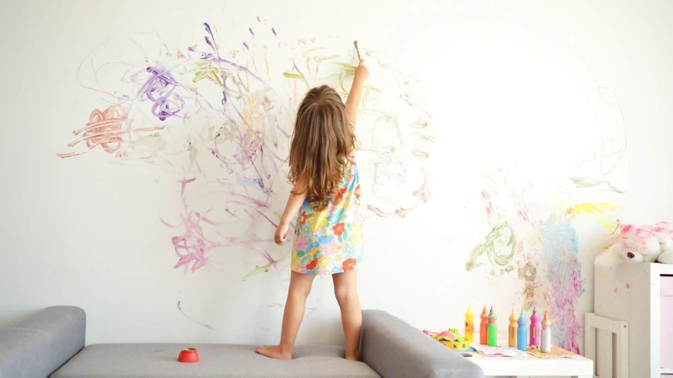 After Wife Asks Her Husband To Paint Over Their Kid's Drawing, He Paints Mickey Mouse Around It child drawing on the walls