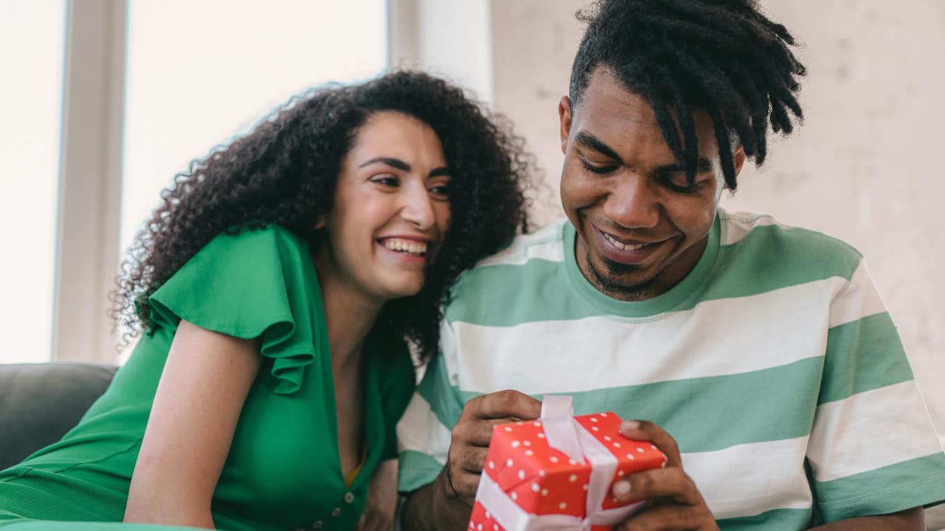 wife giving husband a present 