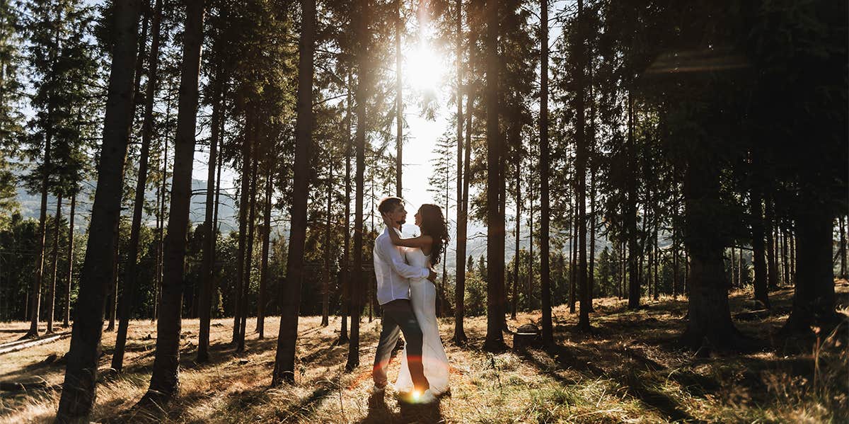 couple kissing in the woods