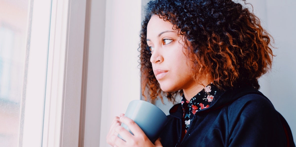 woman staring out the window