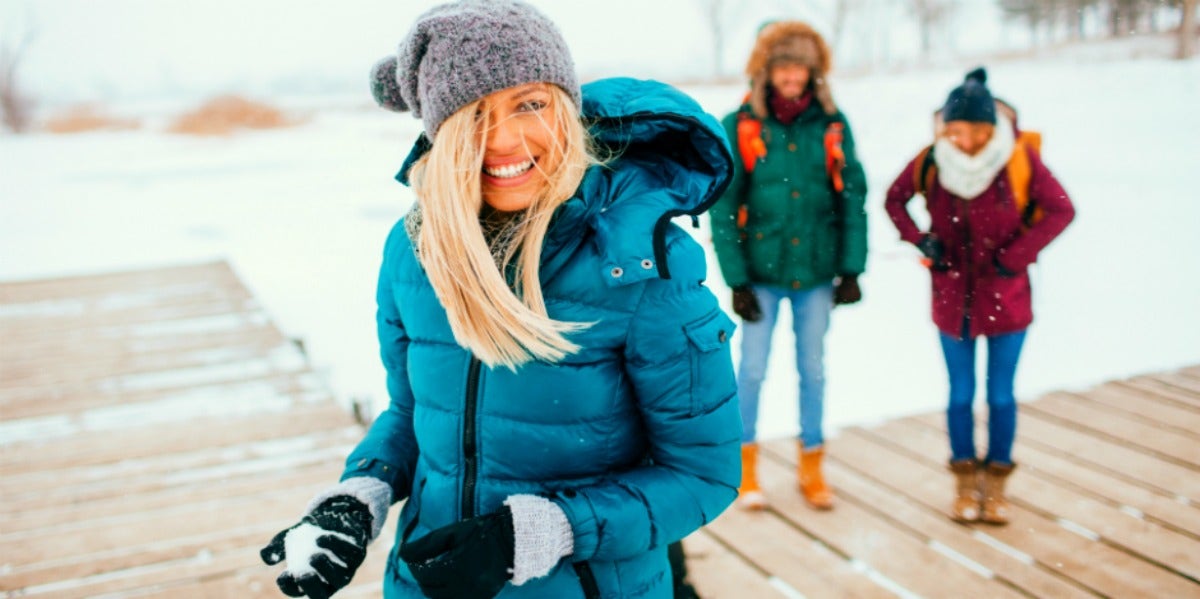 woman celebrating winter solstice in the snow