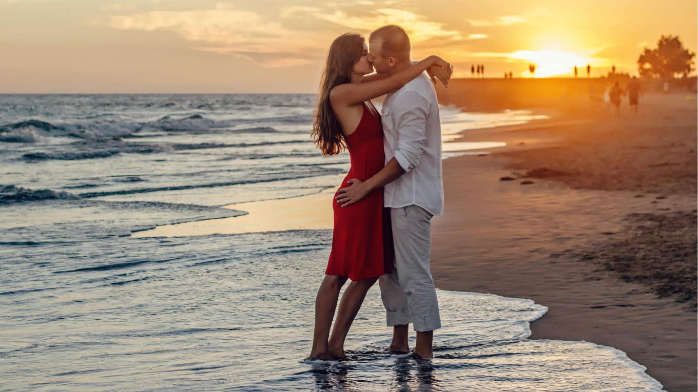 couple kissing on beach 