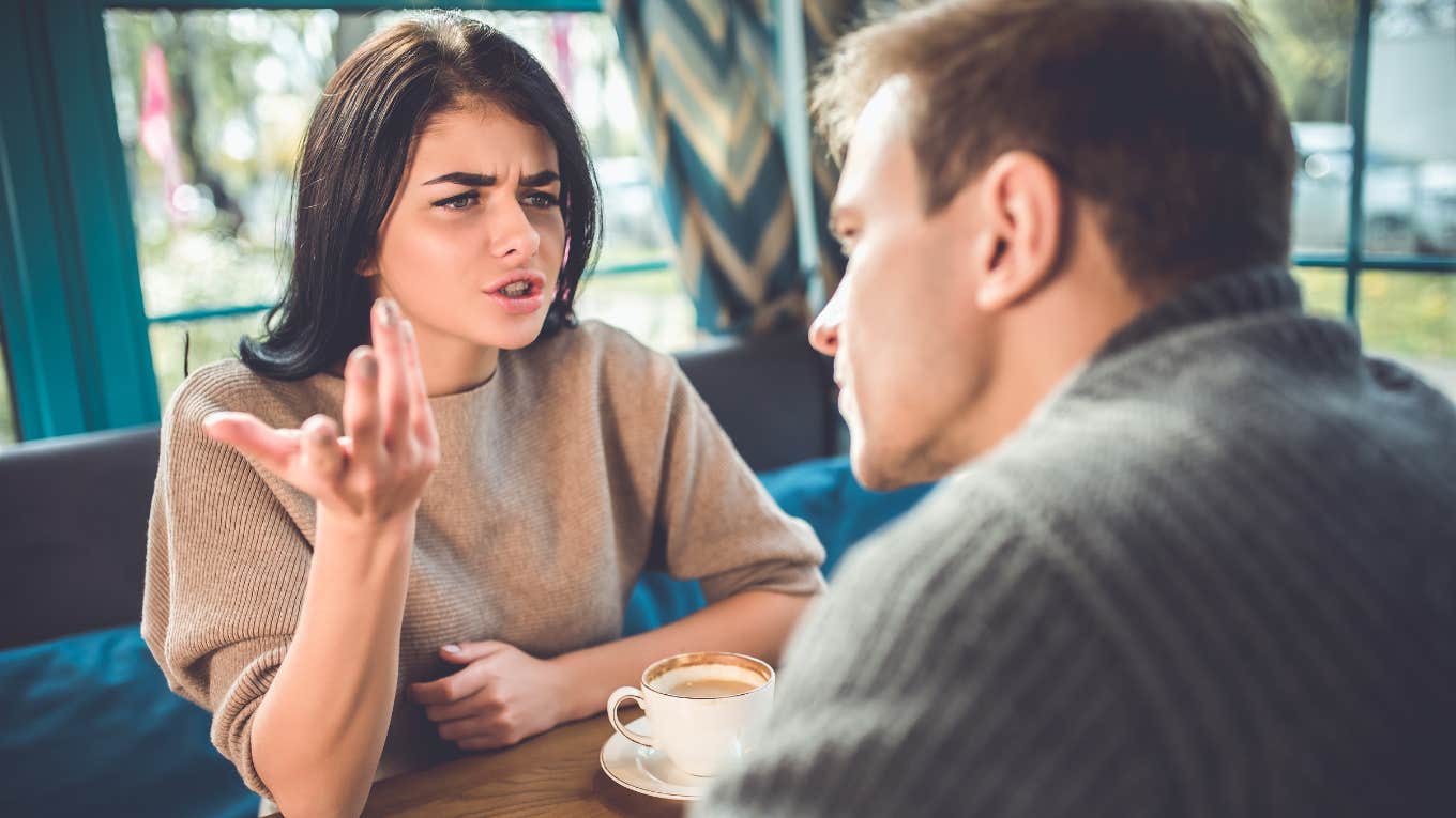 man and woman quarreling in the restaurant