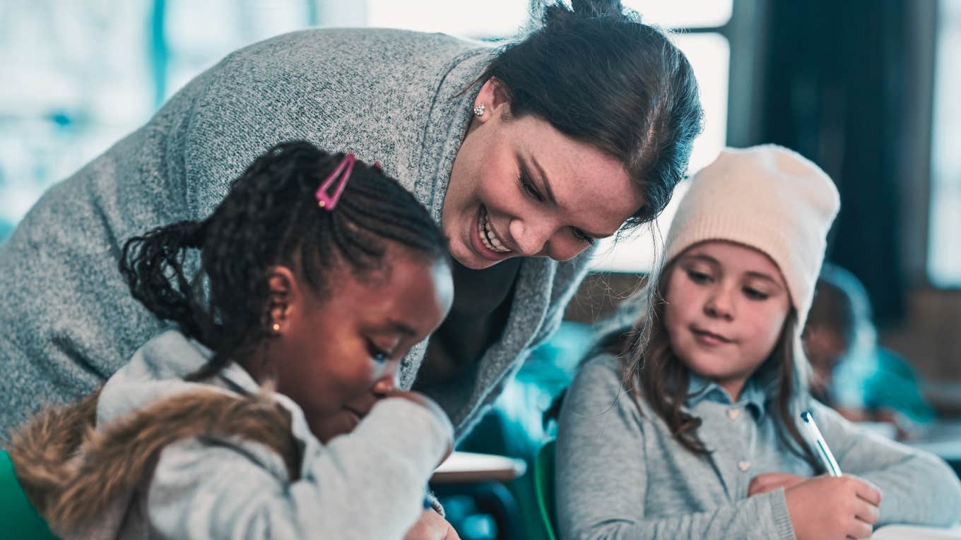 teacher helping students