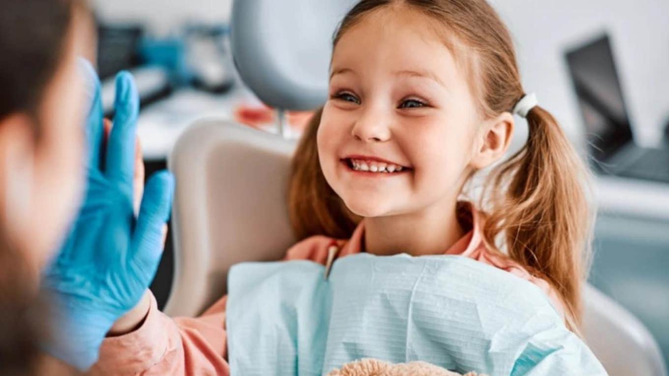 Woman Begs Parents To Take Kids To The Dentist little girl smiling after a cleaning at dentist