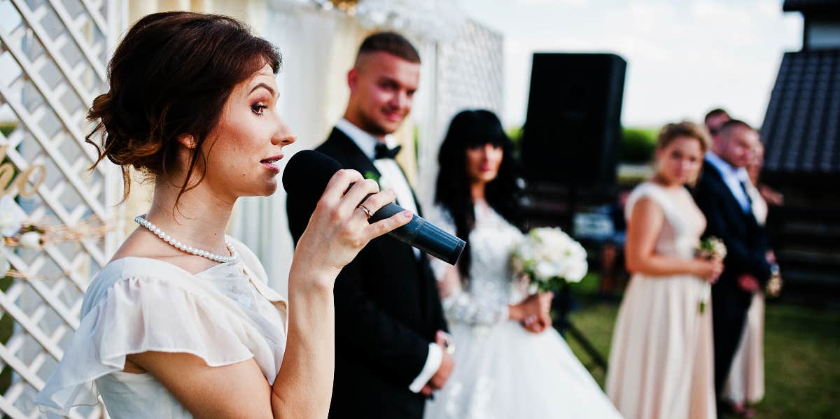 woman giving speech at a wedding