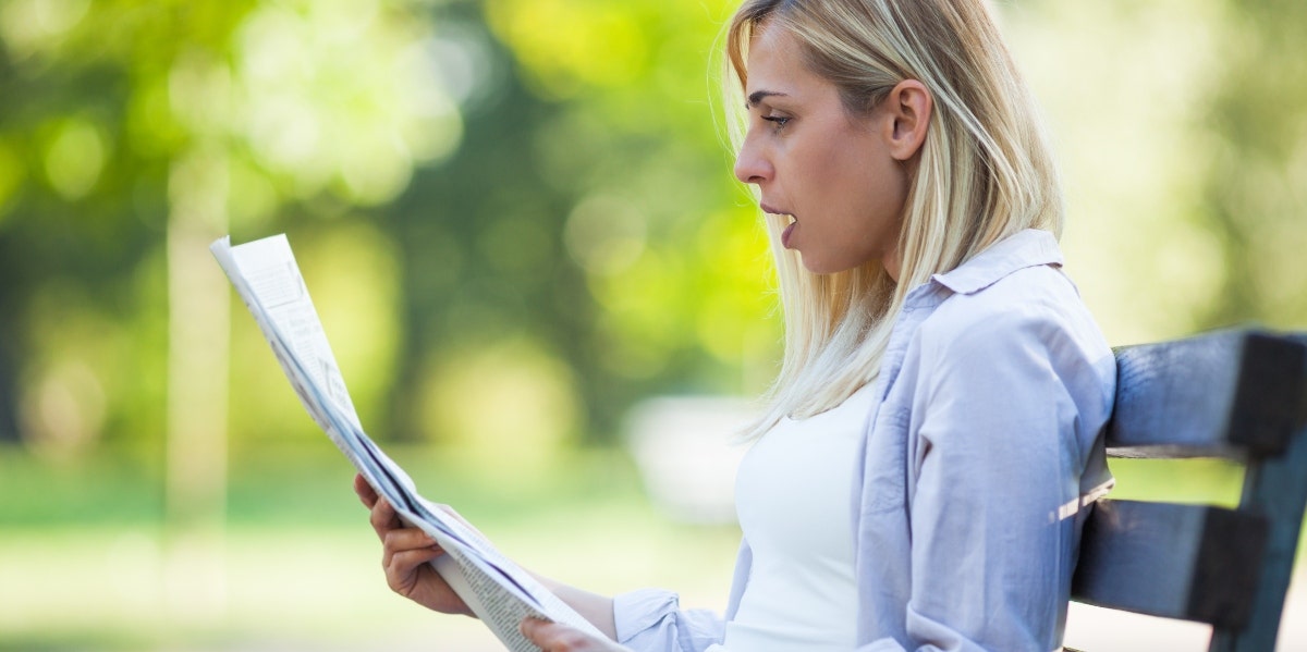 Woman Reading Newspaper