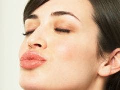 woman puckering up her lips for a kiss