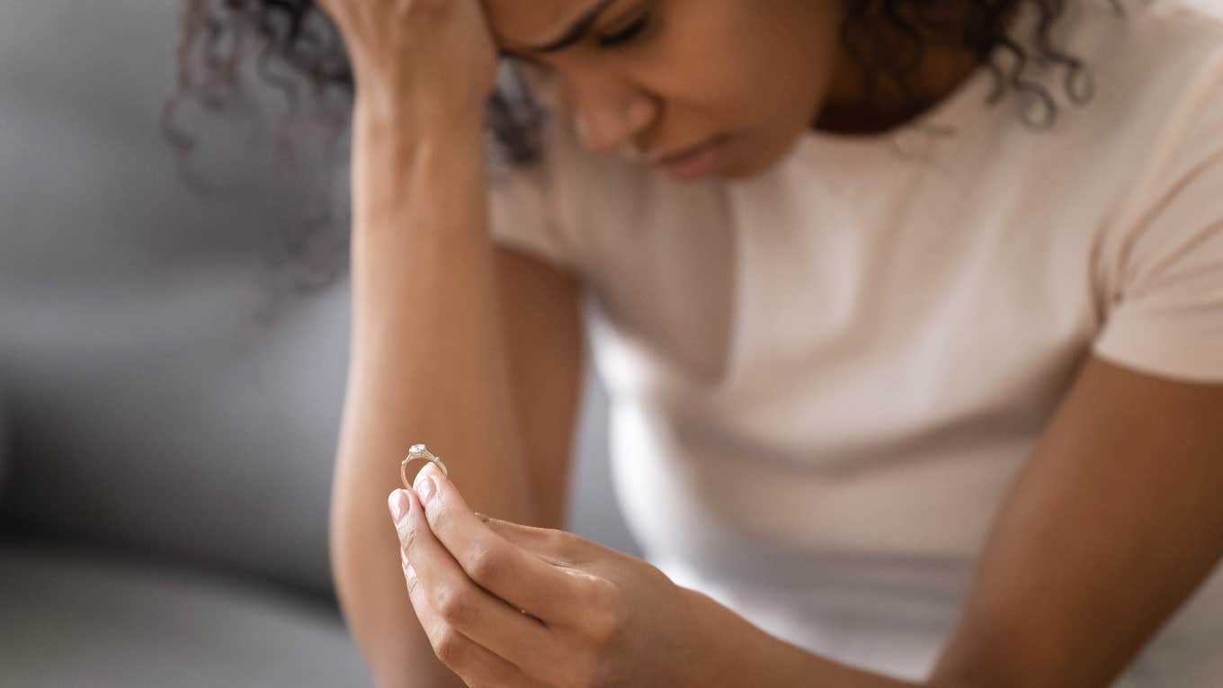 young woman taking off ring