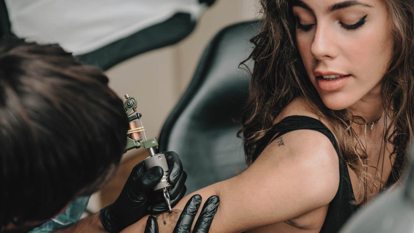 woman getting a tattoo