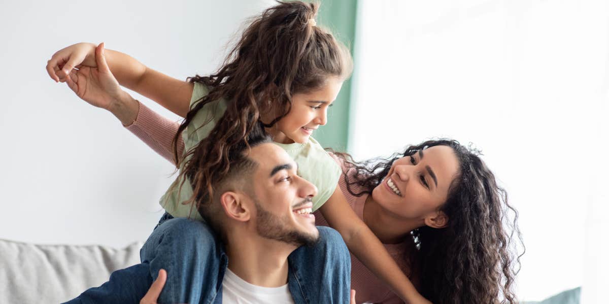 family of three playing at home