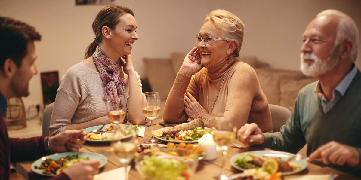 Woman Exposes Mother-In-Law's Snooping At Family Dinner After Tricking Her With A Fake Key woman having dinner with husband's family