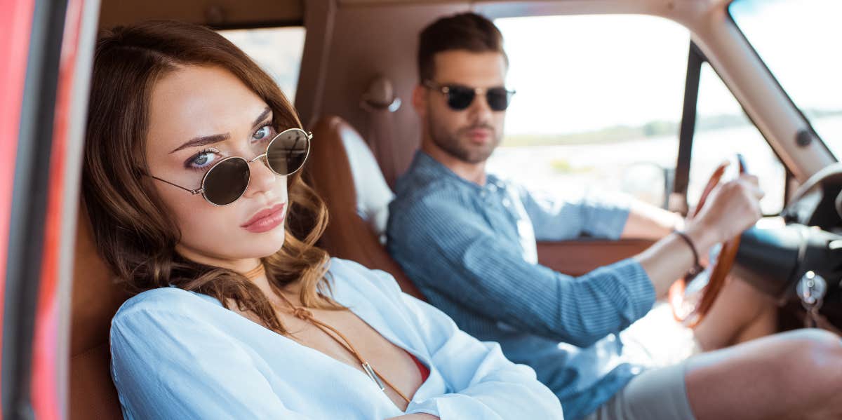 Woman Fears She 'Won't Enjoy' Her Honeymoon If Her Fiance's Daughter Comes Along Even Though They're Already Bringing Their Baby Woman upset in car with her boyfriend