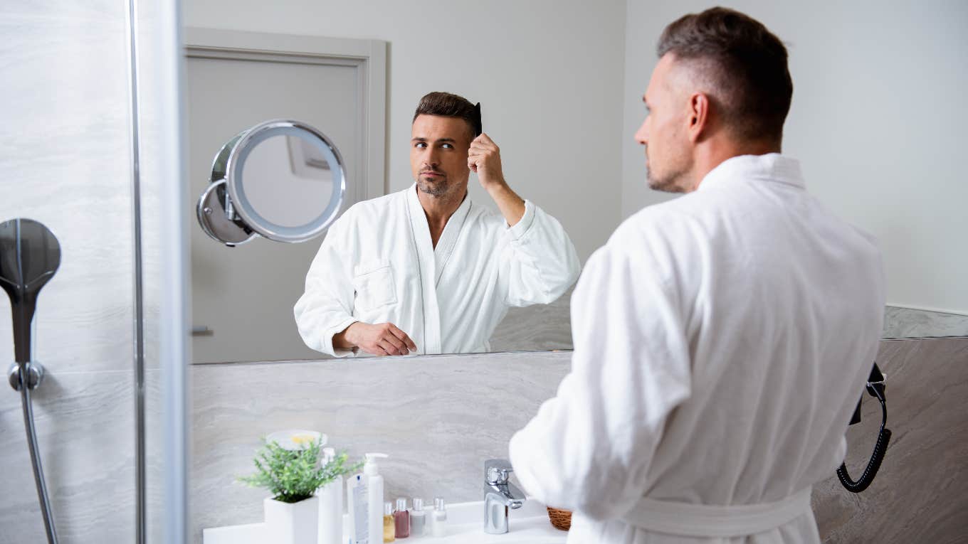 Man getting ready in bathroom