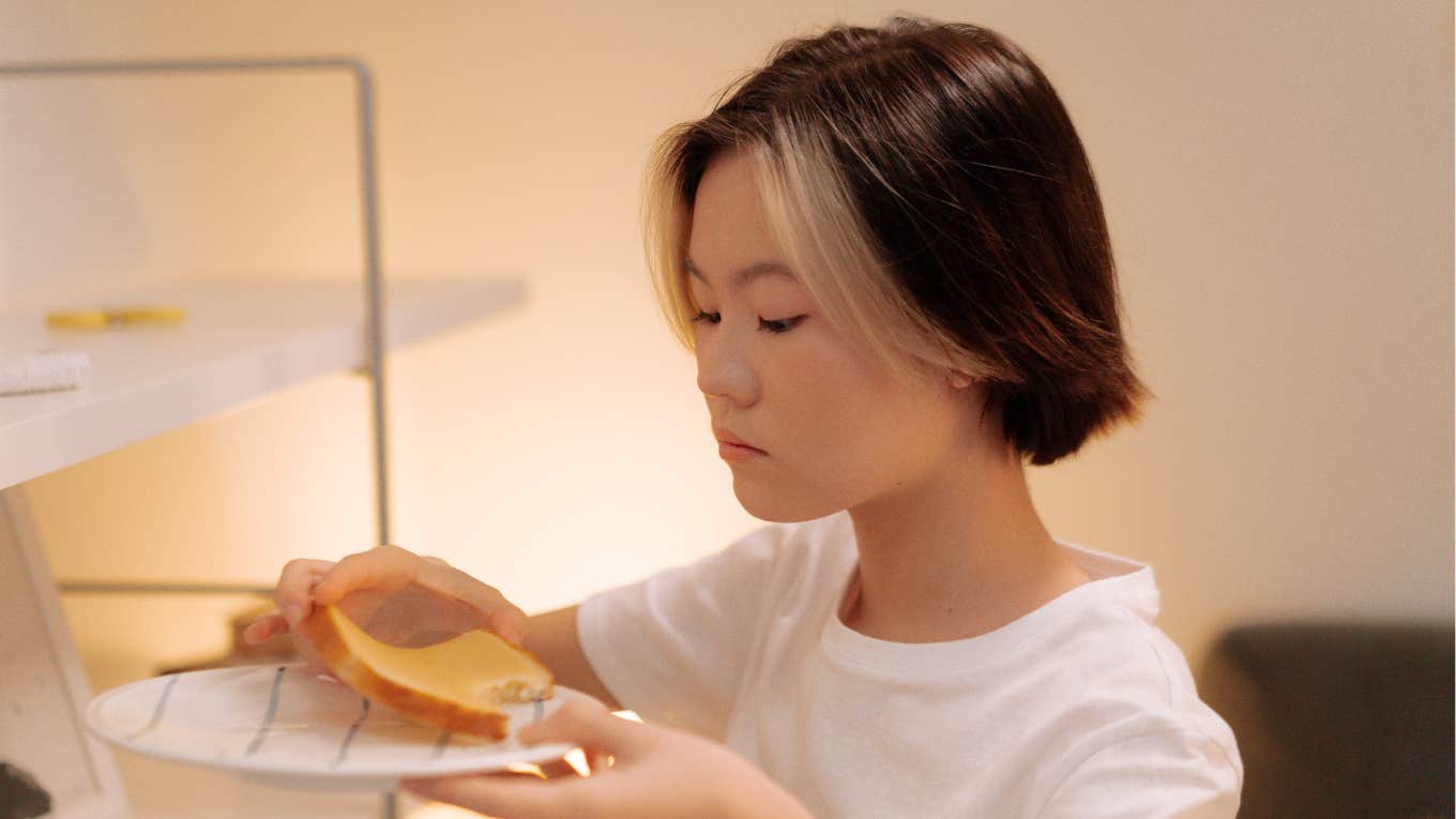 Woman Claims She Was Food Shamed By A Panera Employee For Choosing Bread As A Side woman eating bread