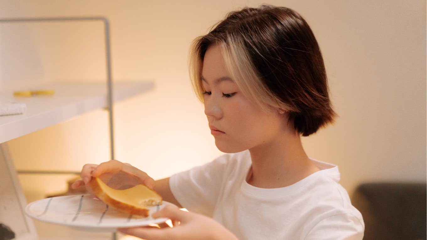 woman eating bread