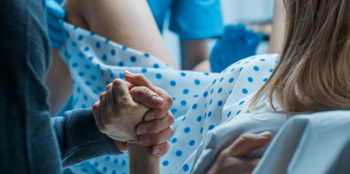 woman giving birth in hospital