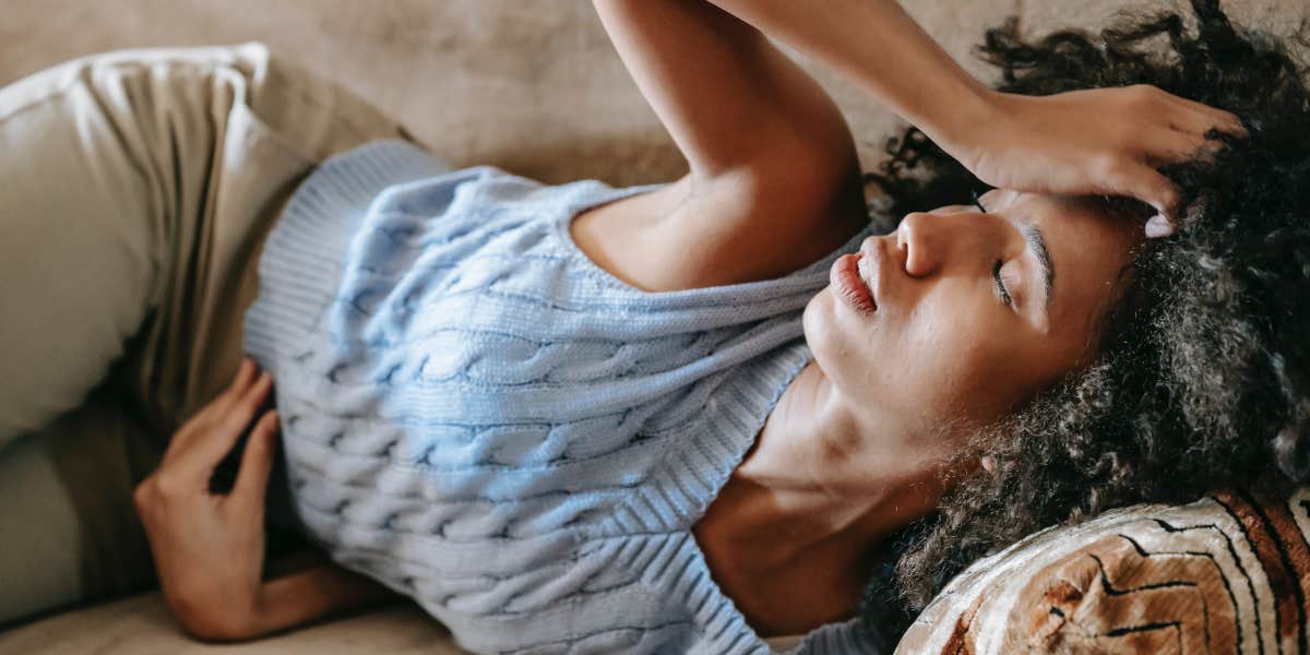 Woman lying down with headache