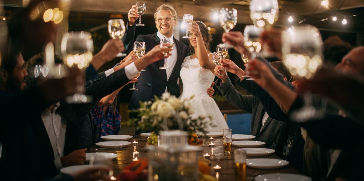 bride and groom doing wedding toast at reception