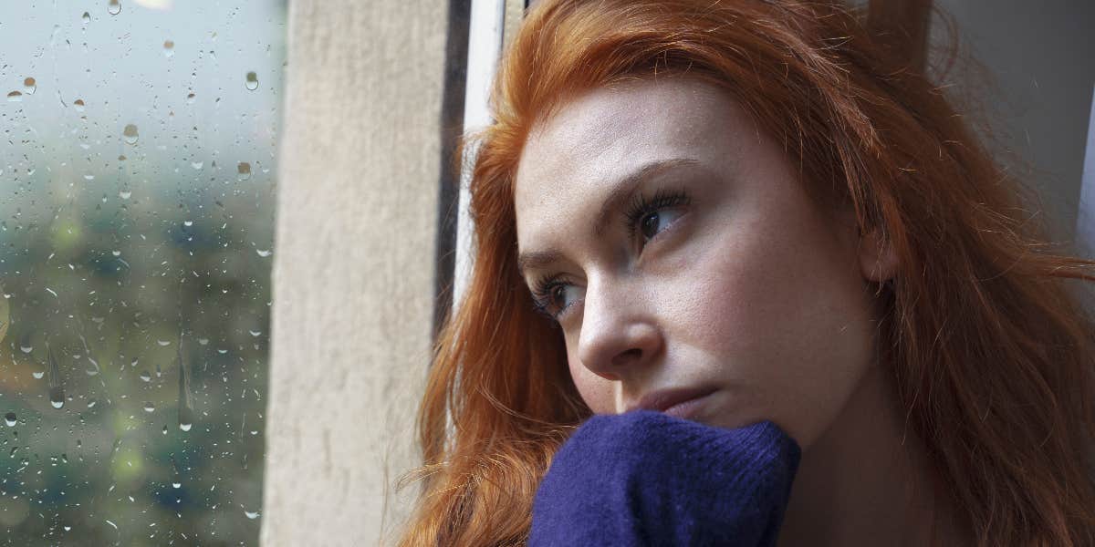 Woman Stalked Her Husband After They First Met To Win Him Over Woman looking out the window