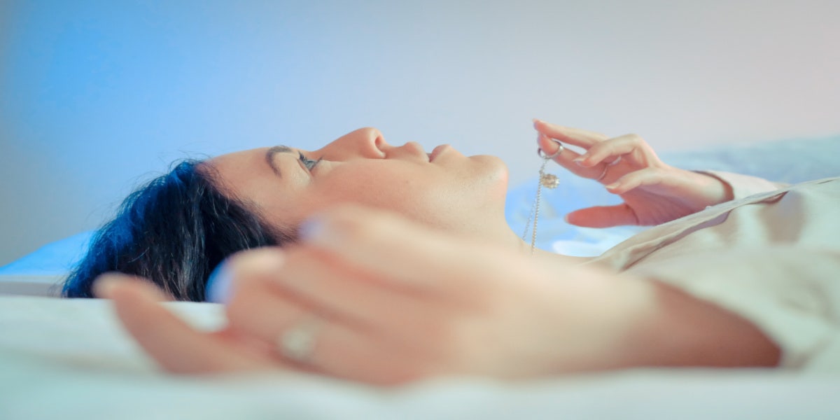 Clitoris Piercing: Types, Benefits, Risks & Healing Time woman lying down