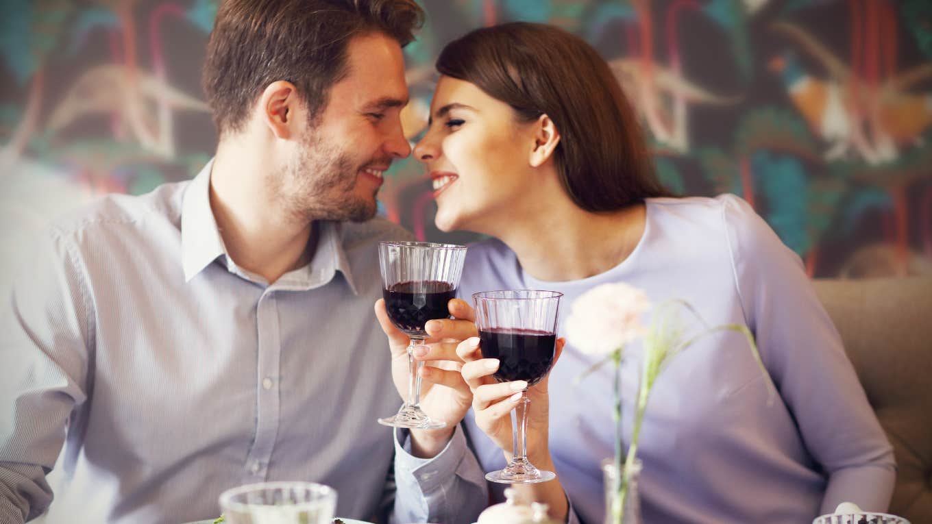 Woman Disappointed After Receiving A Card Signed By Restaurant Staff Instead Of Free Dessert man and woman drinking wine romantic dinner