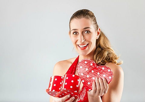 woman opening valentine's day gift woman opening valentine's day gift