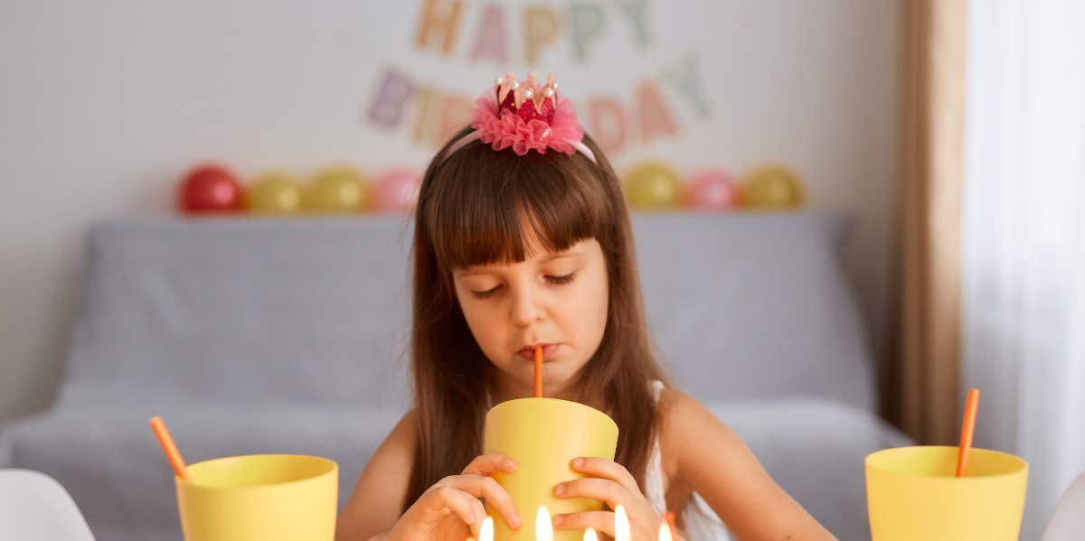 Girl sad at birthday party