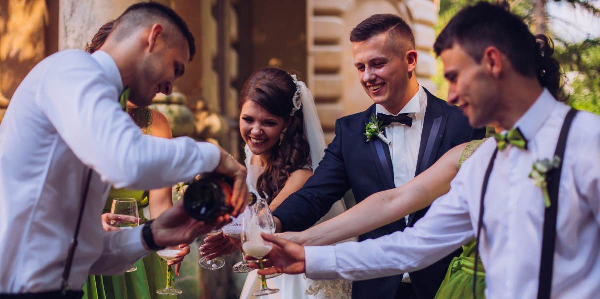 Man celebrating with the bride and groom