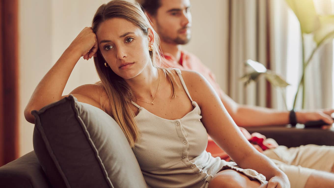 woman stressed, upset and frustrated by her boyfriend after an argument