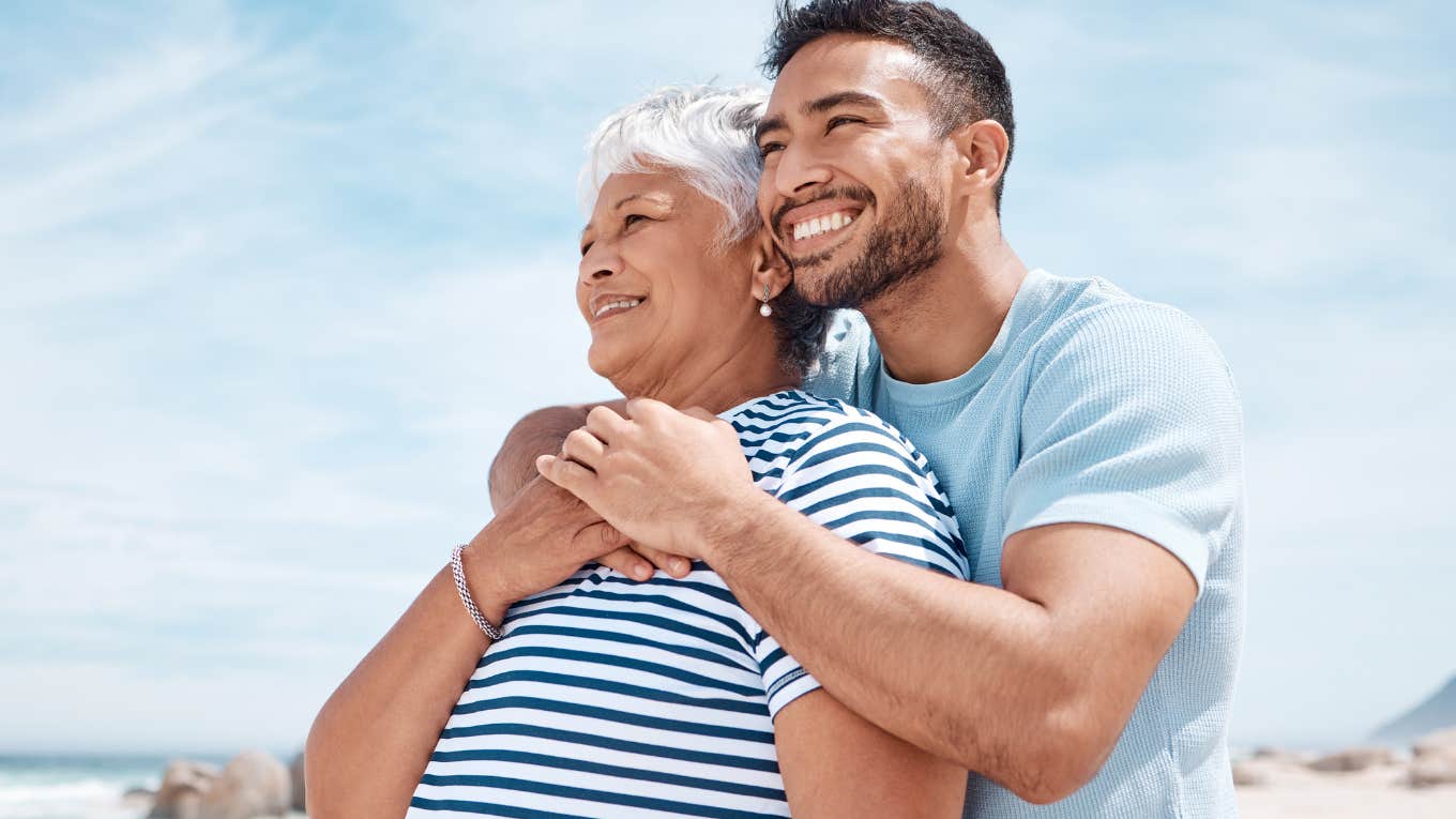 man embracing his grandmother