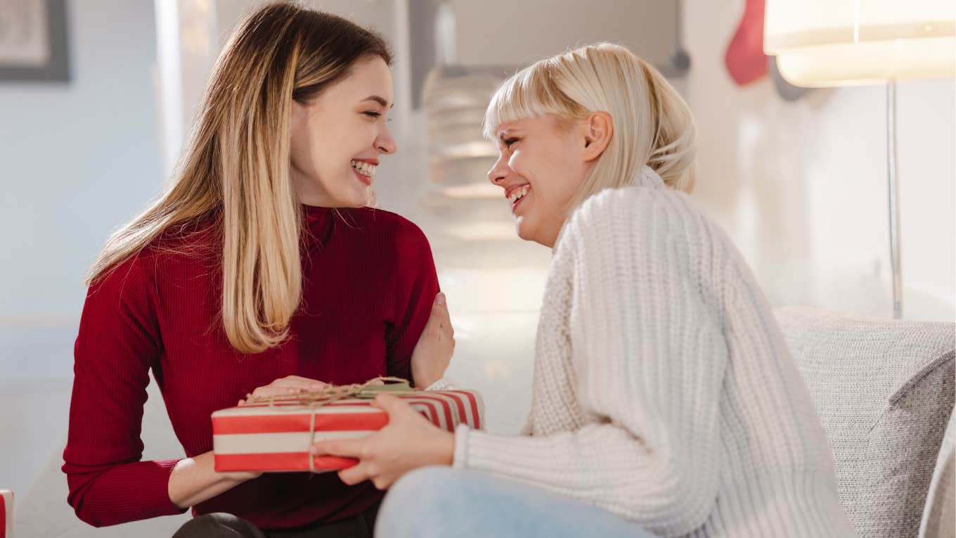 Two friends sharing gifts with each other. 